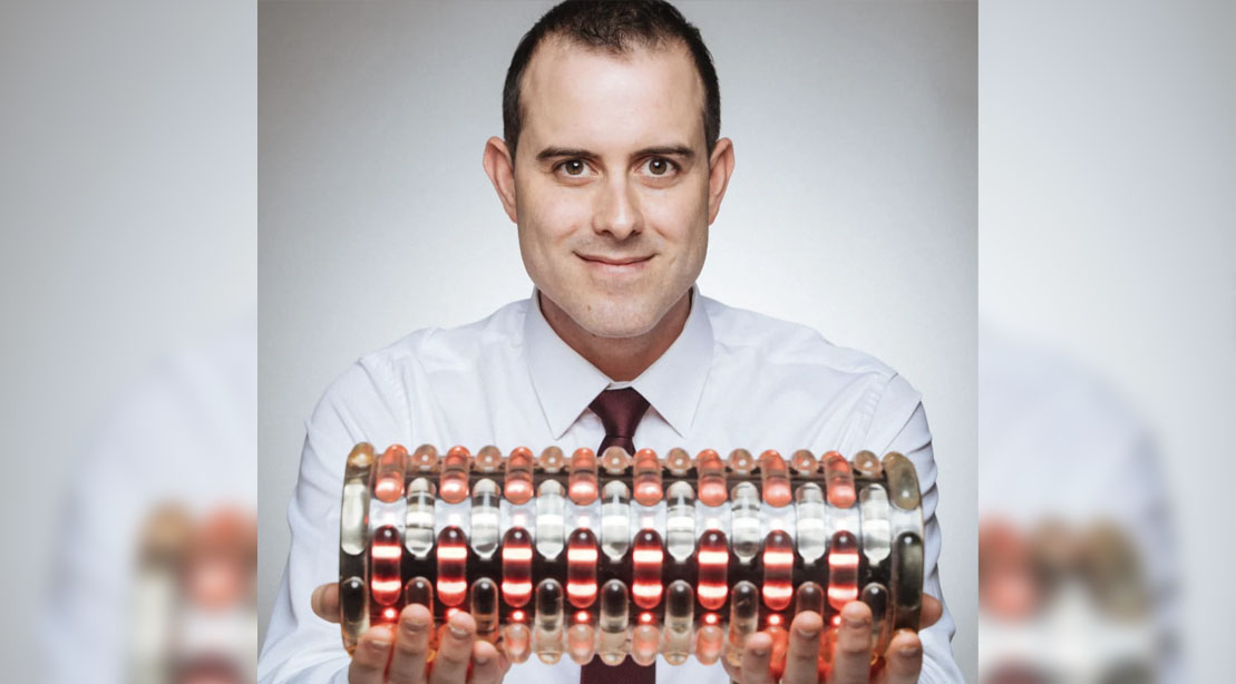 Bradley Carden CEO of Solbasium red light therapy showing his red light device for recovery