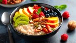 Healthy oatmeal breakfast with fresh fruit and nuts